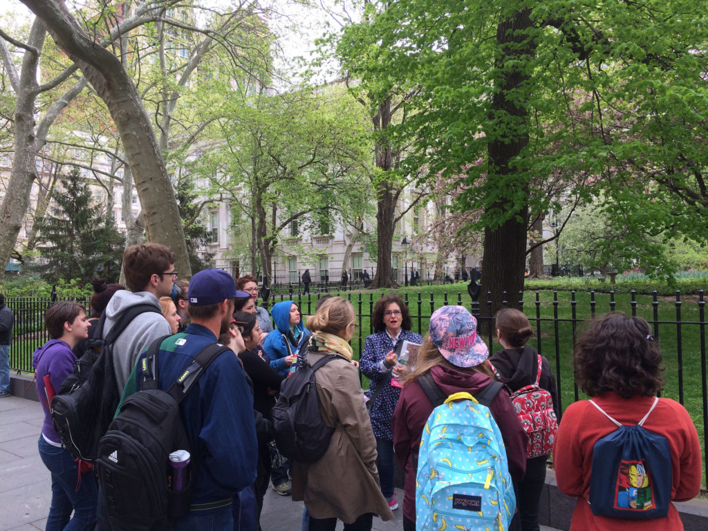 students gathered around a walking tour guide