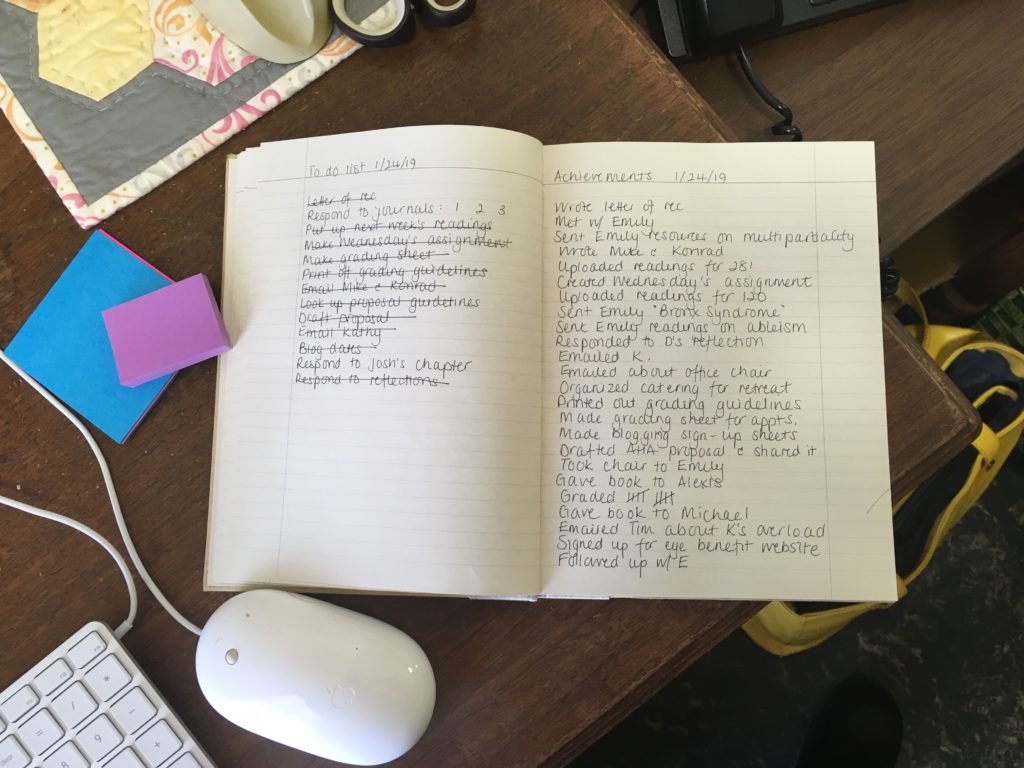 A photo of a notebook with a page with a to-do list on it, and a page of achievements