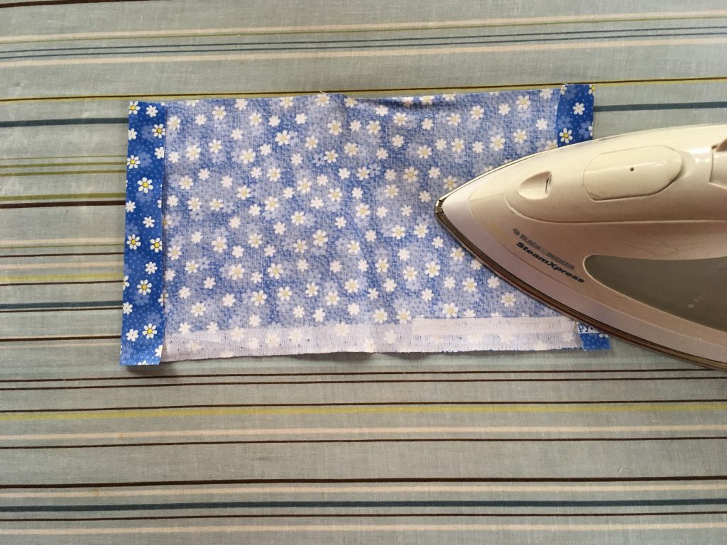 rectangle of fabric with edges ironed down